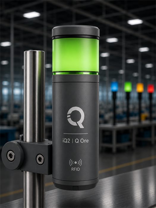 QOne Smart Device glowing green, mounted on a sewing machine thread stand